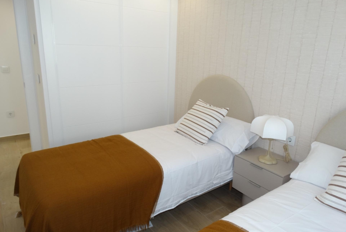 Bright, cozy twin bedroom with modern decor in a new build bungalow for sale in Pilar de la Horadada