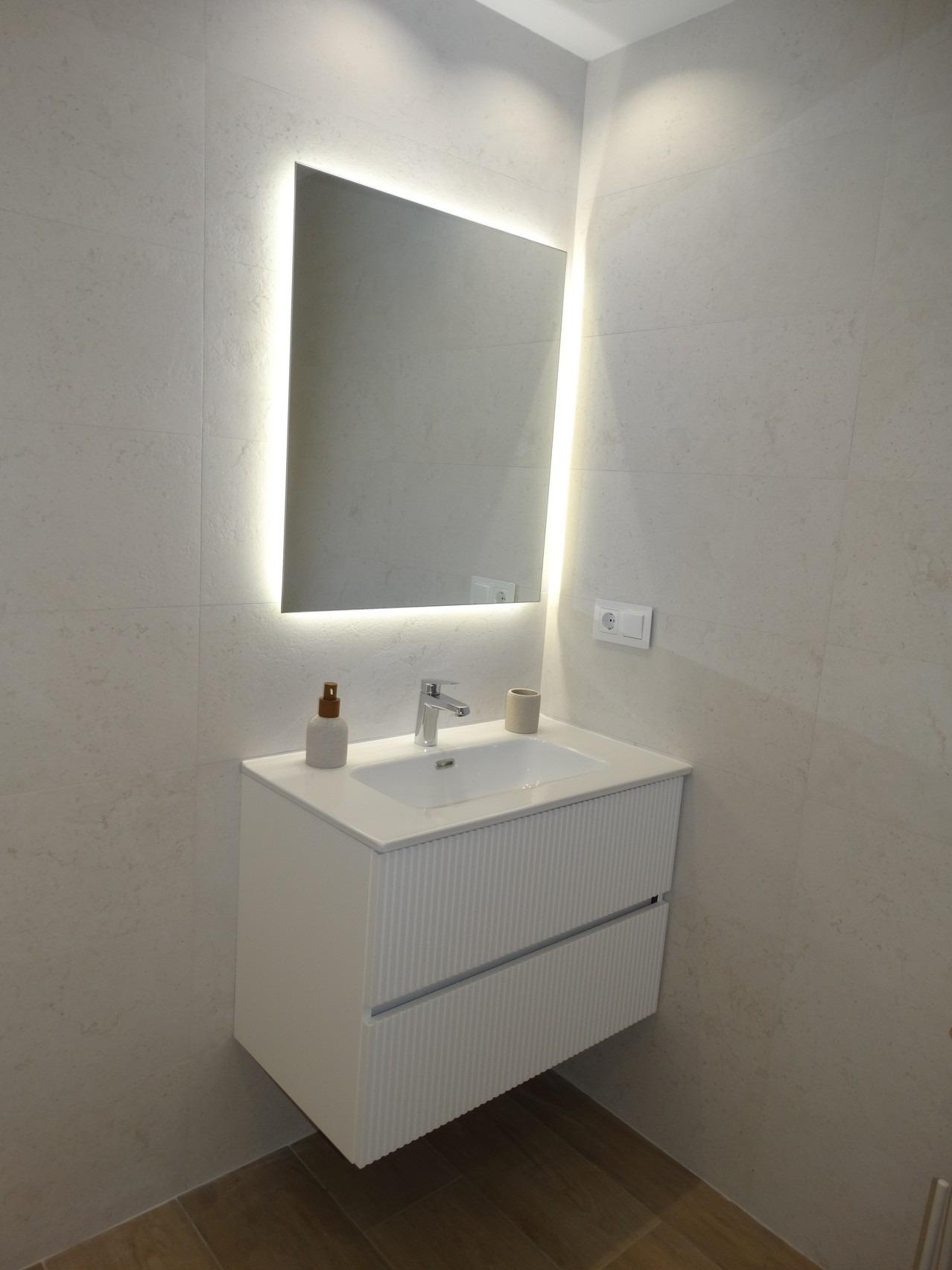 Modern-New-Build-Bungalows-for-Sale-in-Pilar-de-la-Horadada-21 Bright modern bathroom vanity with illuminated mirror in luxury new build bungalow in Pilar de la Horadada