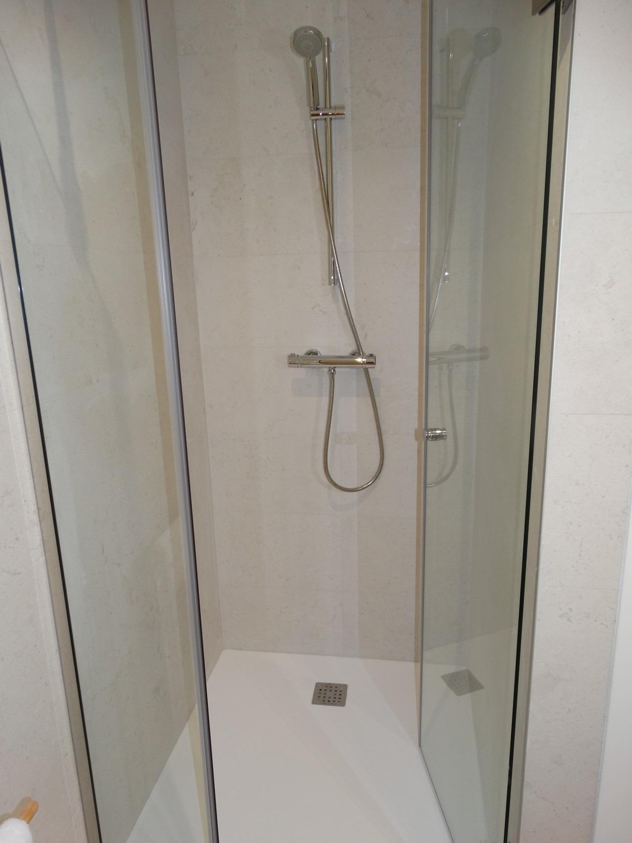 Modern-New-Build-Bungalows-for-Sale-in-Pilar-de-la-Horadada-22 Sleek, modern walk-in shower with glass enclosure in luxury new build bungalows for sale in Pilar de la Horadada.