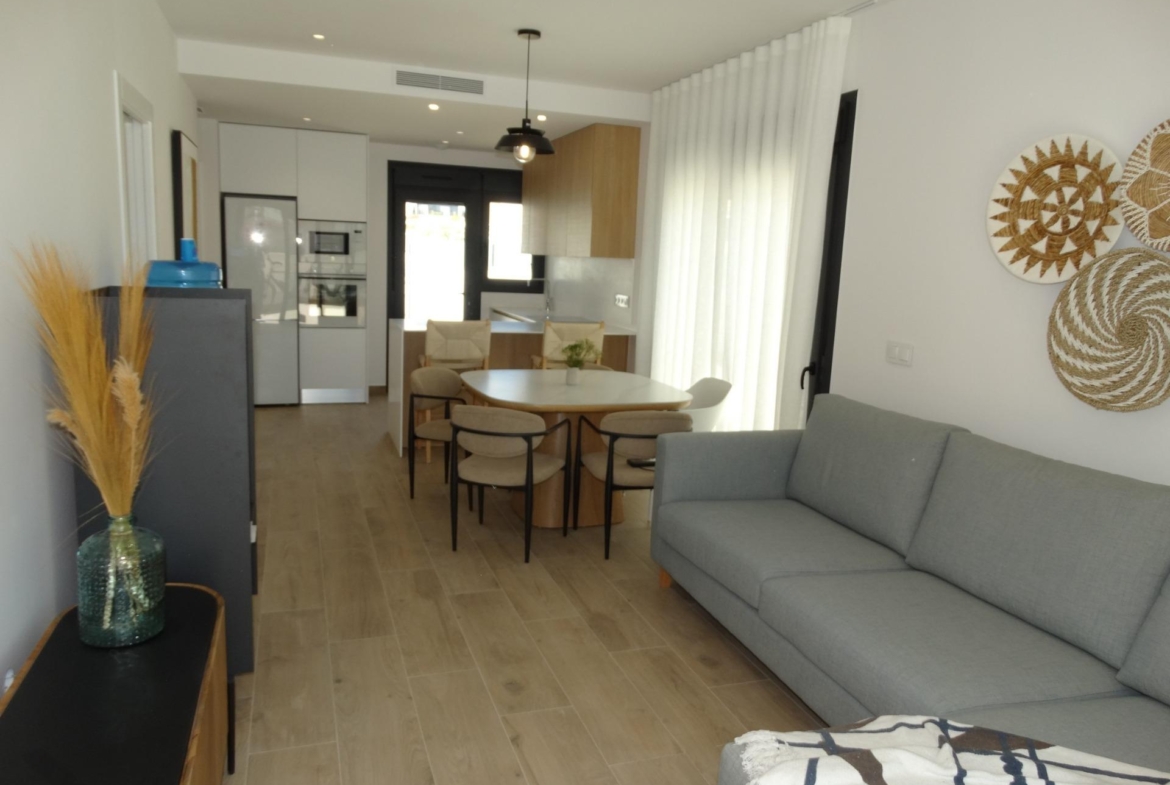 Bright modern open-plan living and dining area in luxury new build bungalow for sale in Pilar de la Horadada