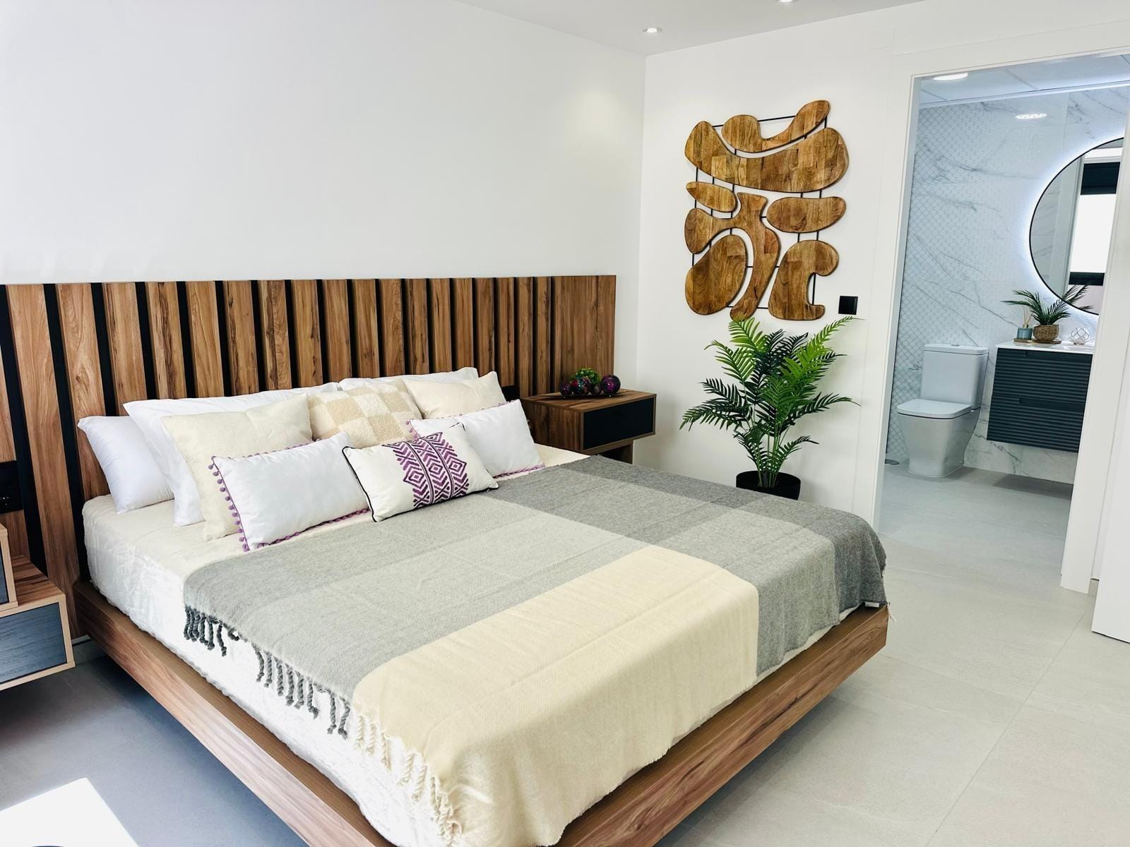 Modern-New-Build-Villas-for-Sale-in-San-Pedro-del-Pinatar-–-Close-to-Beach-and-Town-Centre-13 Bright modern bedroom with wooden headboard and stylish decor in key-ready new build villa, San Pedro del Pinatar Costa Cálida