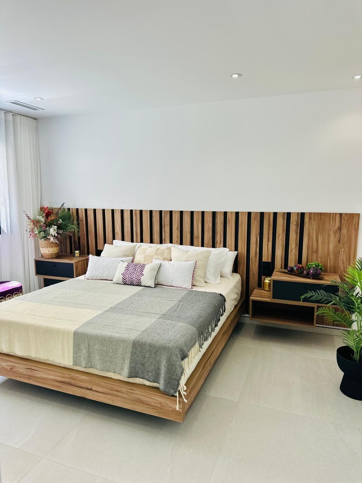 Modern-New-Build-Villas-for-Sale-in-San-Pedro-del-Pinatar-–-Close-to-Beach-and-Town-Centre-20 Bright, modern bedroom with elegant wood panel headboard and soft textiles in luxury new build villa in San Pedro del Pinatar