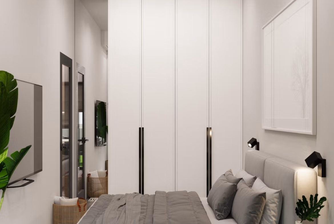 Modern-New-Build-Villas-in-Finestrat-with-Private-Pool-Near-Benidorm-20 Bright, modern bedroom with sleek wardrobe and soft textiles in an energy-efficient 3-bedroom villa in Finestrat, Benidorm.