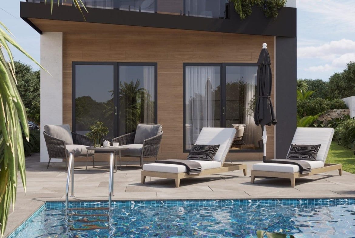 Sun-drenched terrace with modern loungers and a sparkling private pool at an energy-efficient 3-bedroom villa in Finestrat, Benidorm.
