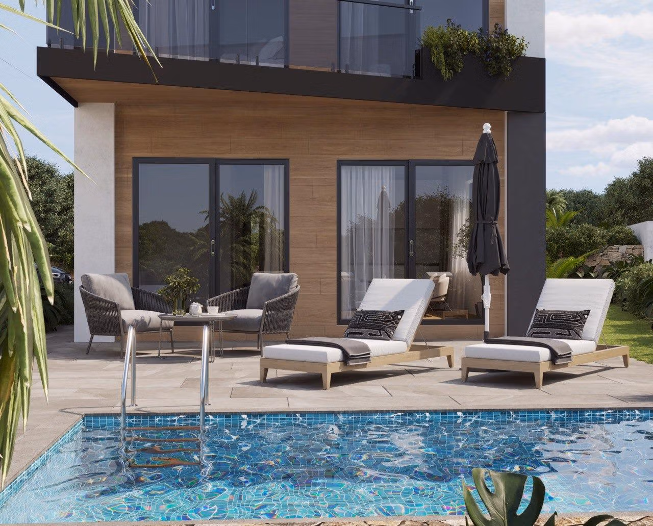 Modern-New-Build-Villas-in-Finestrat-with-Private-Pool-Near-Benidorm-3 Sun-drenched terrace with modern loungers and a sparkling private pool at an energy-efficient 3-bedroom villa in Finestrat, Benidorm.