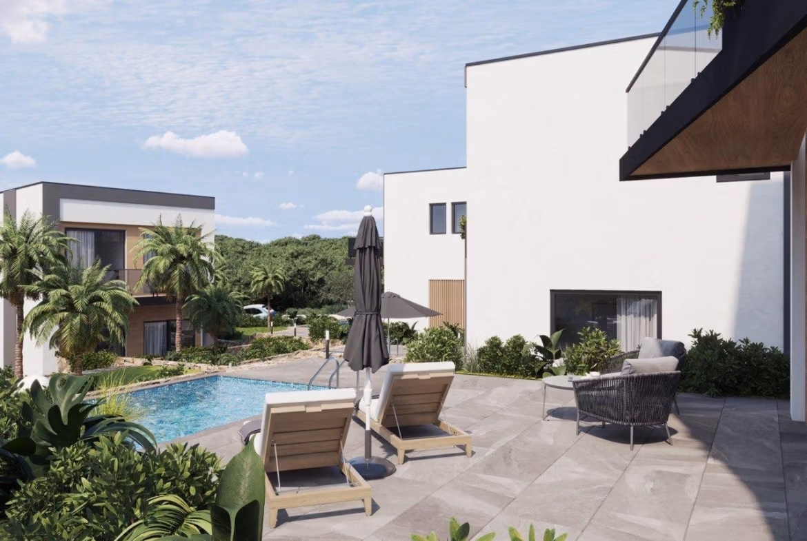 Modern-New-Build-Villas-in-Finestrat-with-Private-Pool-Near-Benidorm-6 Spacious sunlit terrace with modern outdoor seating and private pool at energy-efficient 3-bedroom villa in Finestrat, Benidorm.
