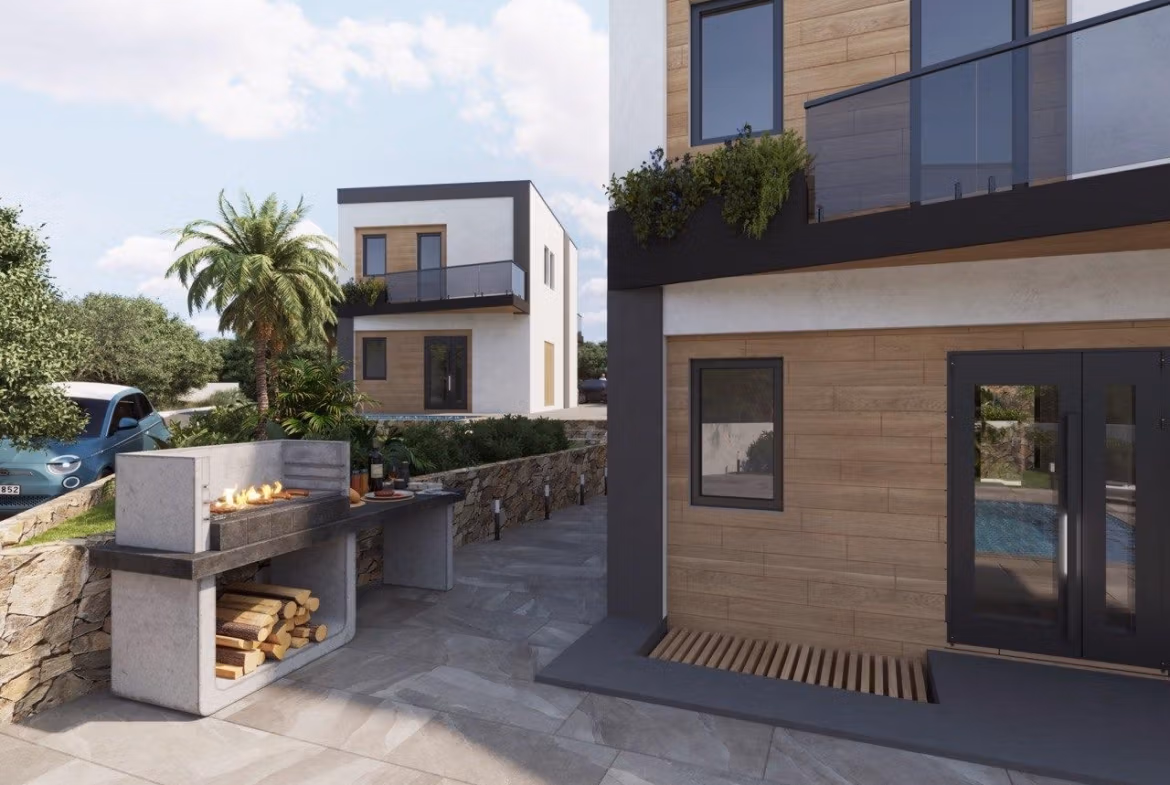 Modern-New-Build-Villas-in-Finestrat-with-Private-Pool-Near-Benidorm-8 Modern energy-efficient 3-bedroom villa exterior in Finestrat with private pool, sleek terrace, and built-in outdoor barbecue area