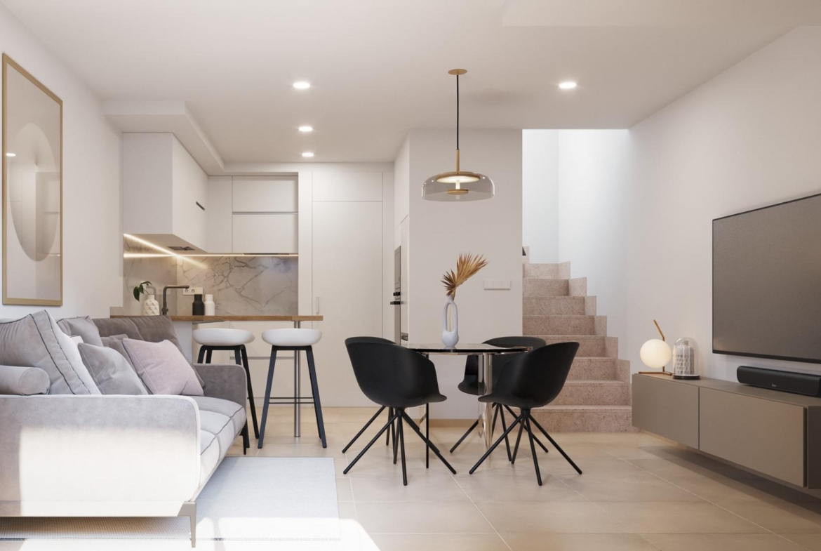 Bright modern open-plan living and dining area with sleek kitchen and staircase in stylish 2-bedroom townhouse in Santa Rosalía, Torre Pacheco