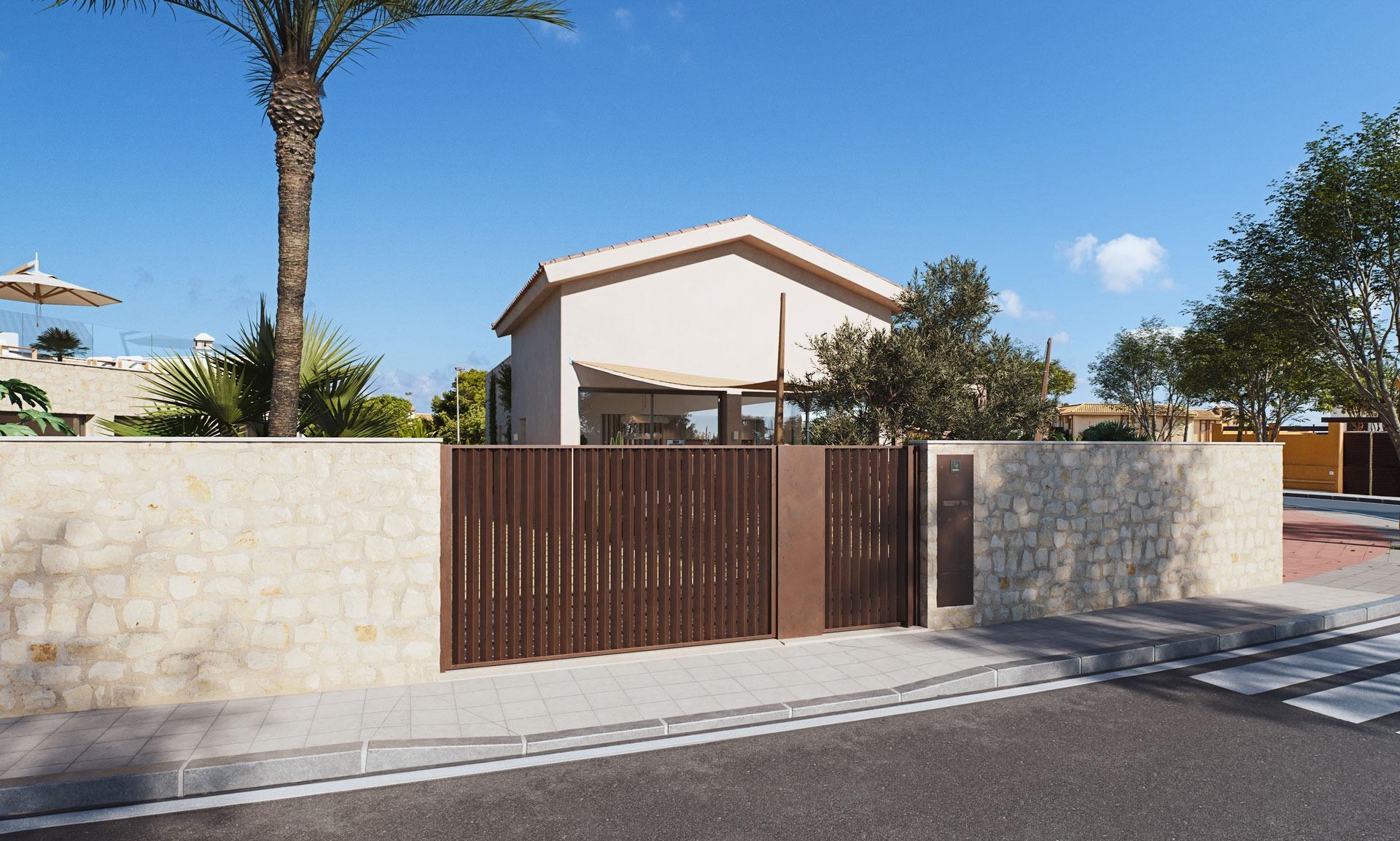 Modern villa exterior with stone wall and wooden gate under clear blue sky, just 150 meters from the beach in Cabo de Palos, Costa Cálida
