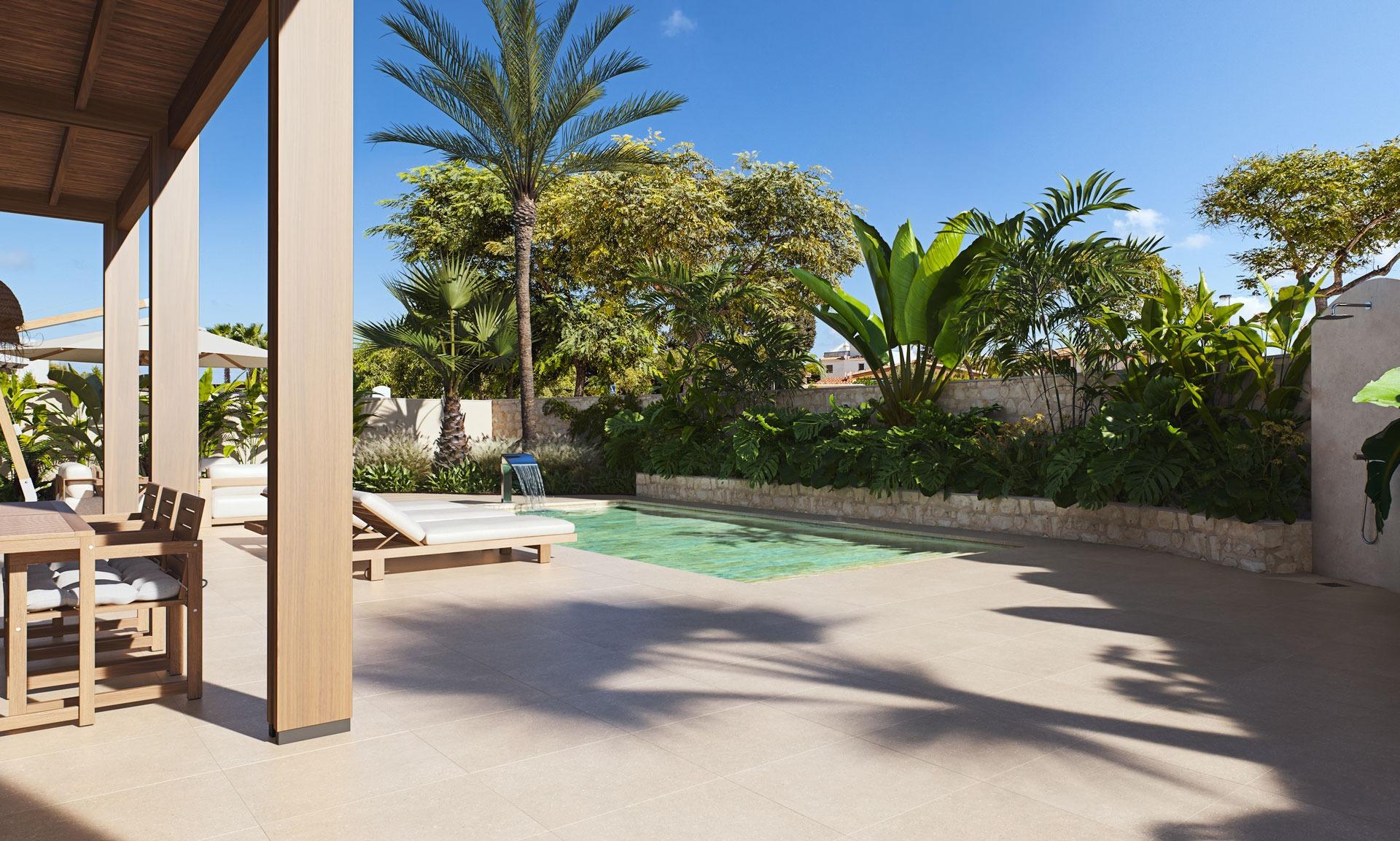 Sun-drenched modern villa terrace with private pool and lush landscaping in Cabo de Palos, Costa Cálida