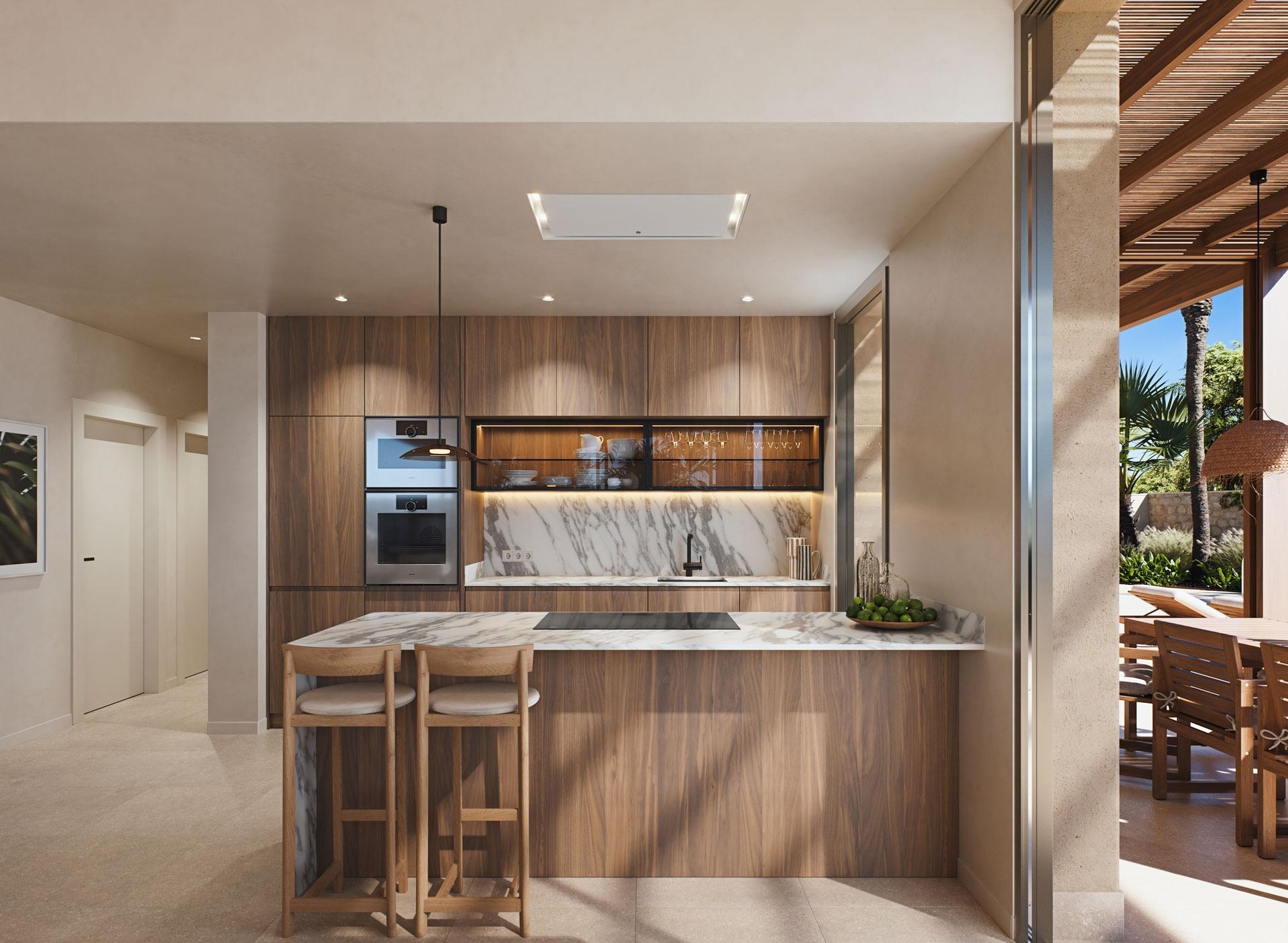 Sunlit modern kitchen with marble island and wooden cabinetry in a luxury villa near the beach in Cabo de Palos, Costa Cálida.