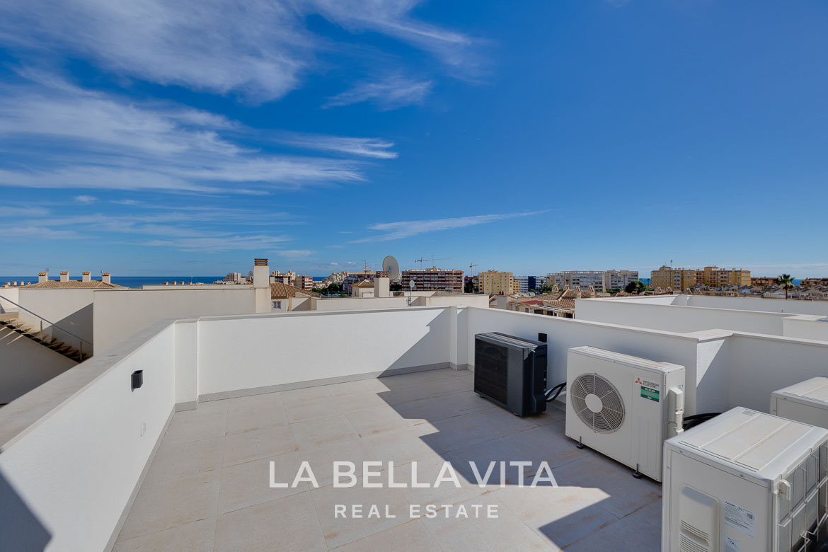 Modern villa with private pool, solarium and basement near La Mata beach, Torrevieja-14 Sun-drenched spacious rooftop terrace of a modern 4-bedroom villa in Torreblanca, Torrevieja with panoramic urban views.