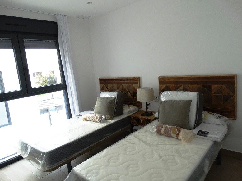 Bright modern twin bedroom with large window in luxury new build 3-bedroom villa in Pilar de la Horadada