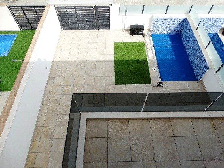 Sunlit modern 3-bedroom semi-detached villa in Pilar de la Horadada with sleek private pool and spacious tiled terrace.