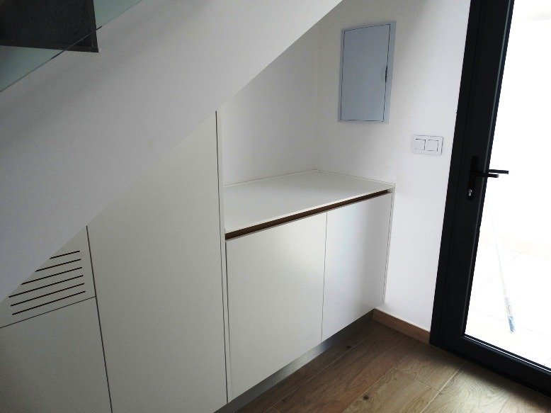 Bright modern storage area with sleek cabinetry and glass door in a 3-bedroom semi-detached villa in Pilar de la Horadada.