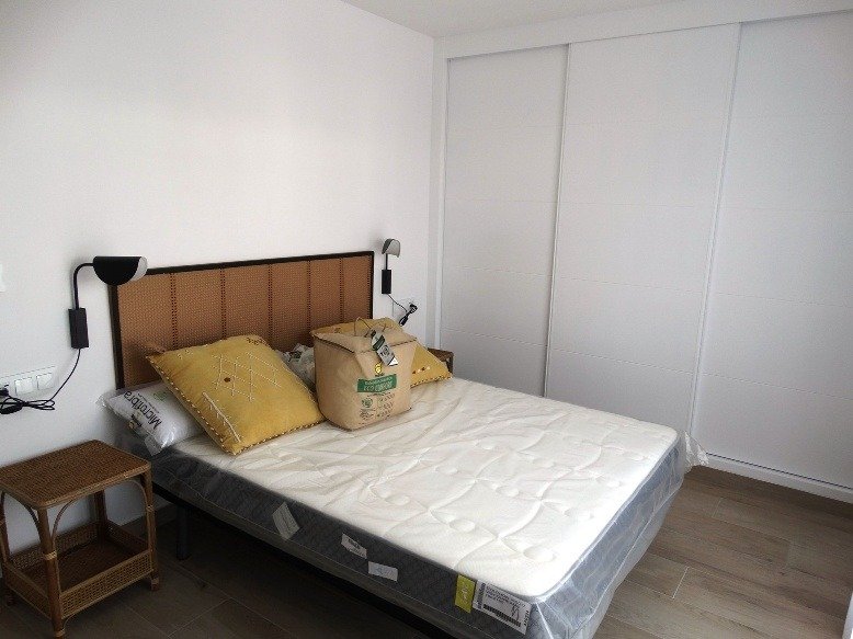 Bright and airy bedroom with modern design and built-in wardrobes in a new 3-bedroom semi-detached villa in Pilar de la Horadada