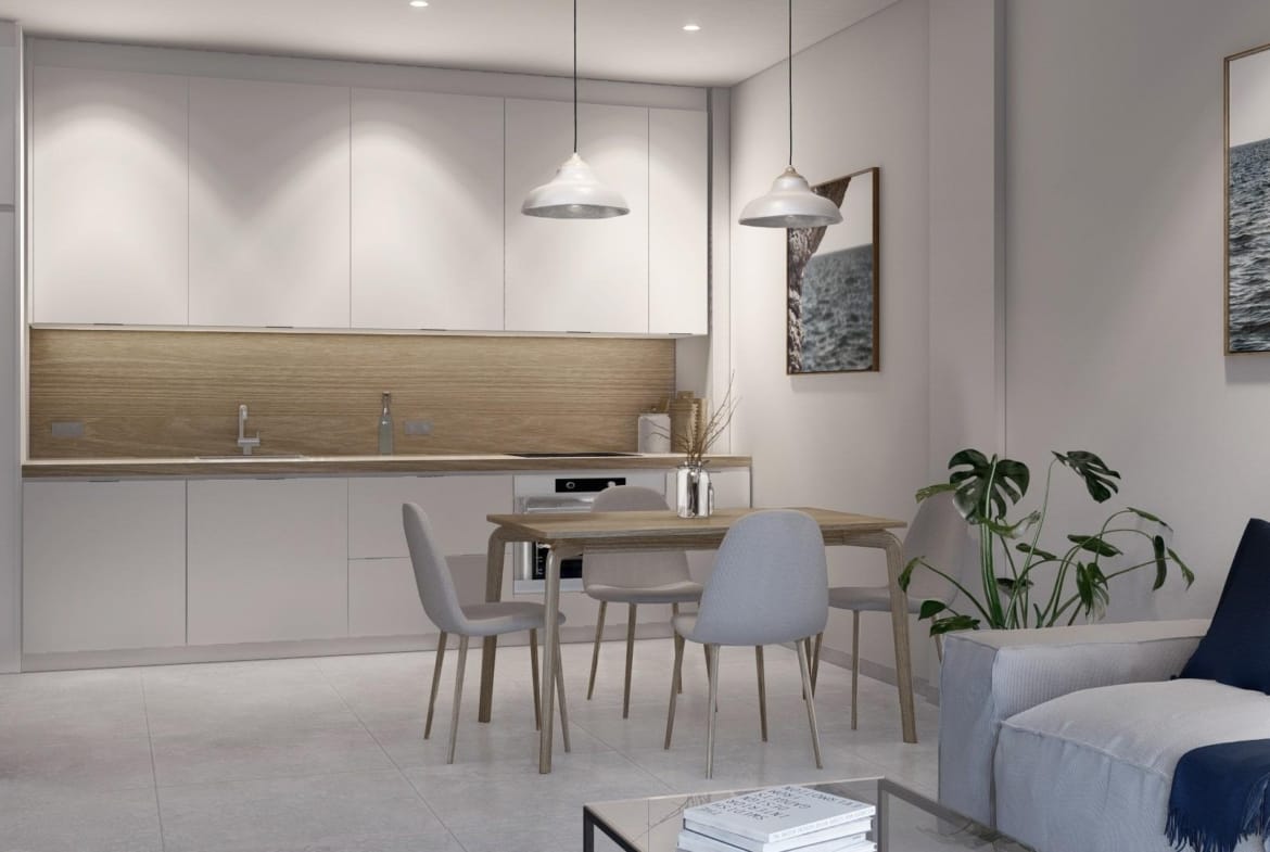 Modern sun-drenched open-plan kitchen and dining area in a new build 3-bedroom apartment in Torre-Pacheco, Murcia.