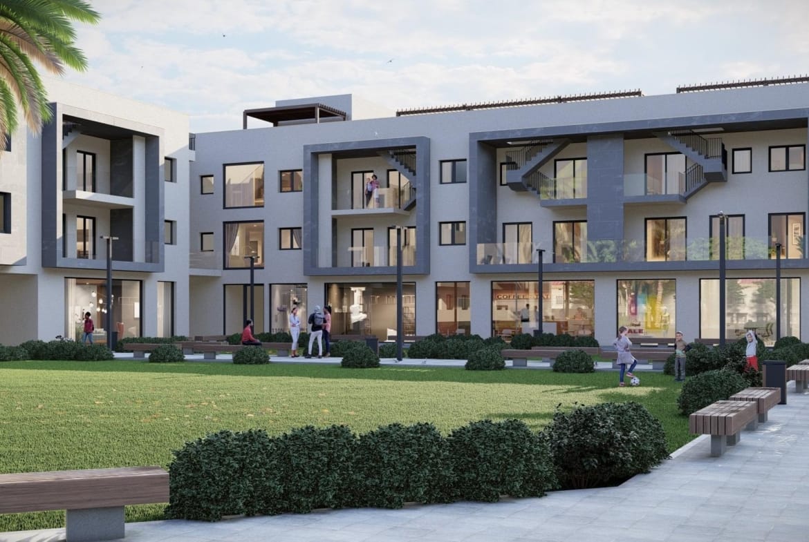 Modern new build 3-bedroom apartment complex in Torre-Pacheco, Murcia, surrounded by landscaped gardens and spacious outdoor seating.