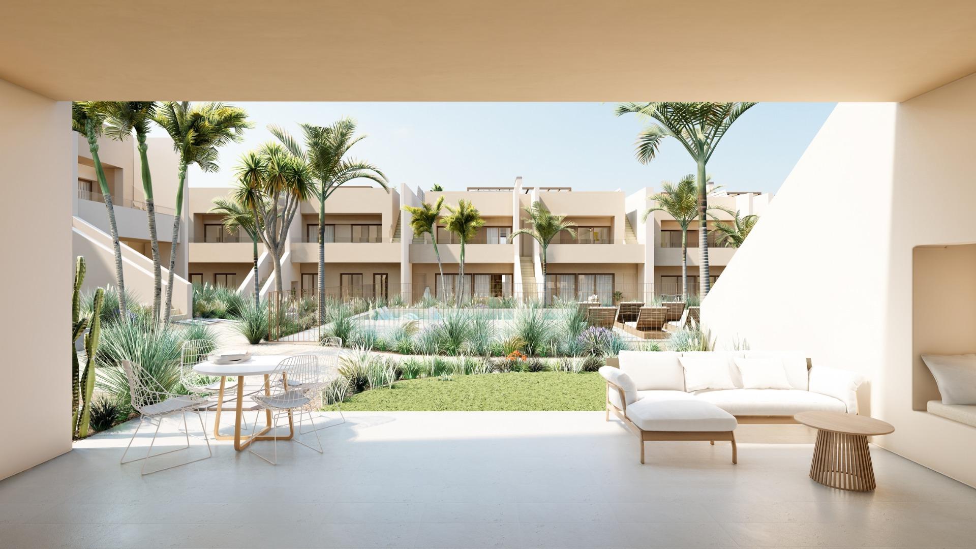 Spacious modern penthouse terrace with lush landscaping and sleek outdoor seating at Roda Golf, San Javier new build.
