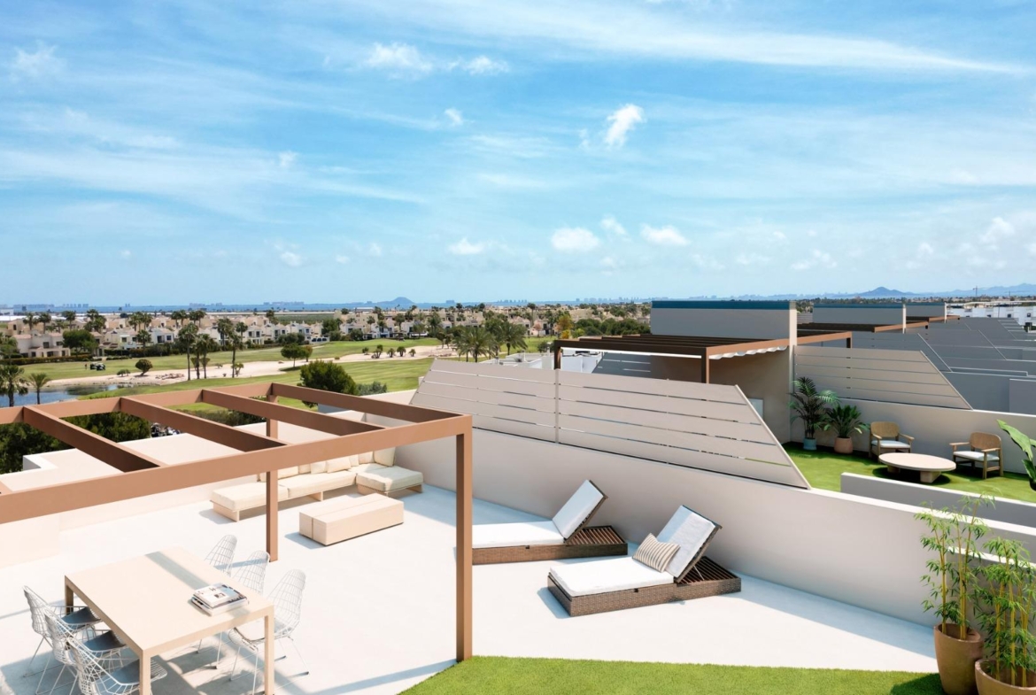 Spacious sun-drenched solarium with modern pergola and loungers overlooking golf course at 3-bedroom penthouse in Roda Golf, San Javier