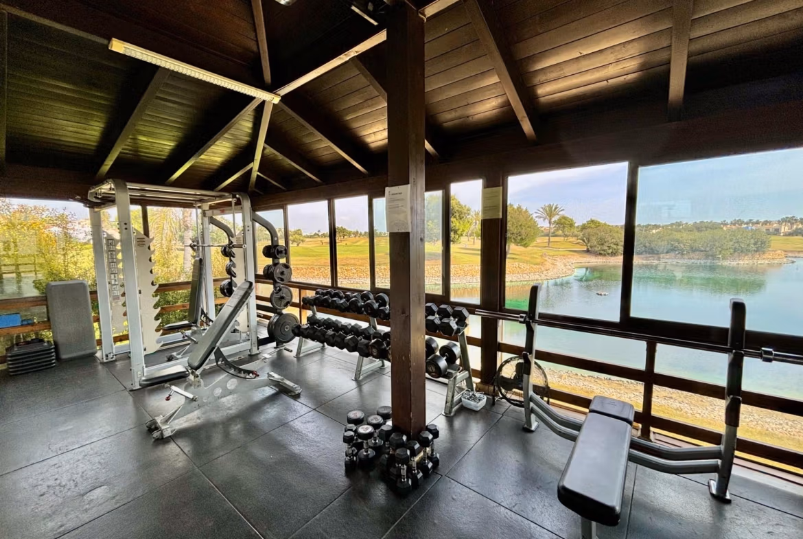 Bright, modern private gym with panoramic golf course and lake views at spacious 3-bedroom ground floor bungalow in Roda Golf, San Javier.
