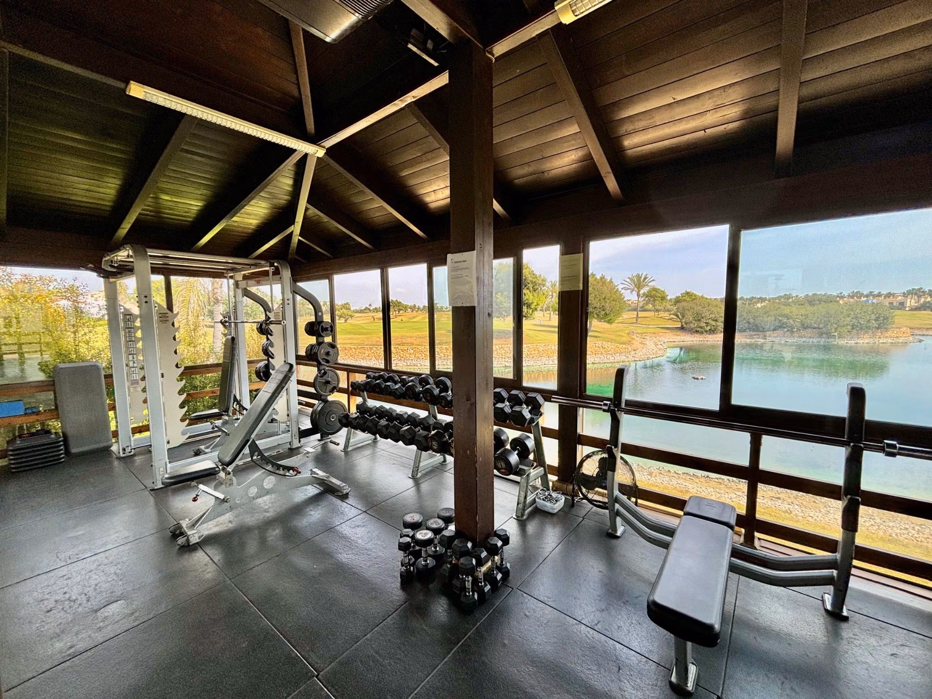 Bright, modern private gym with panoramic golf course and lake views at spacious 3-bedroom ground floor bungalow in Roda Golf, San Javier.