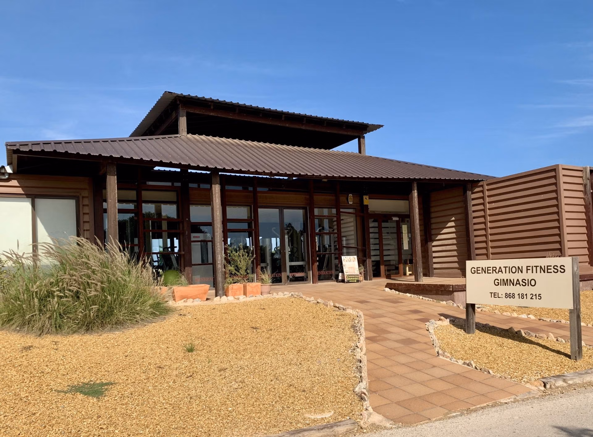 Modern fitness gym exterior with rustic wooden accents near spacious new build 3-bedroom ground floor bungalow in Roda Golf San Javier