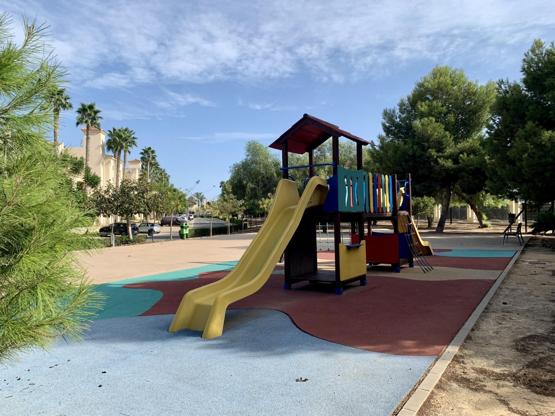 Bright children's playground with slide and climbing structure near spacious new build 3-bedroom bungalow, Roda Golf San Javier