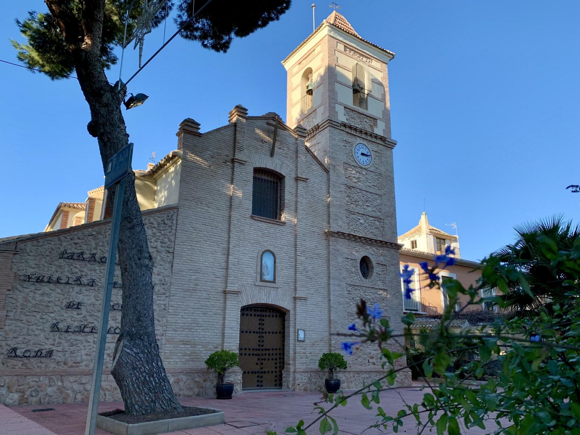 Historic charming church near the modern new build 3-bedroom penthouse at Roda Golf, San Javier under clear blue skies