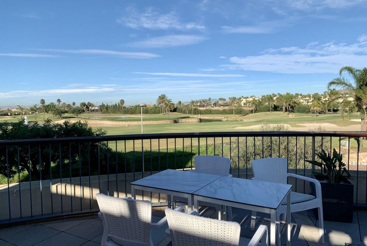 Spacious terrace with modern dining set and panoramic golf course views in luxury 3-bedroom penthouse at Roda Golf, San Javier.