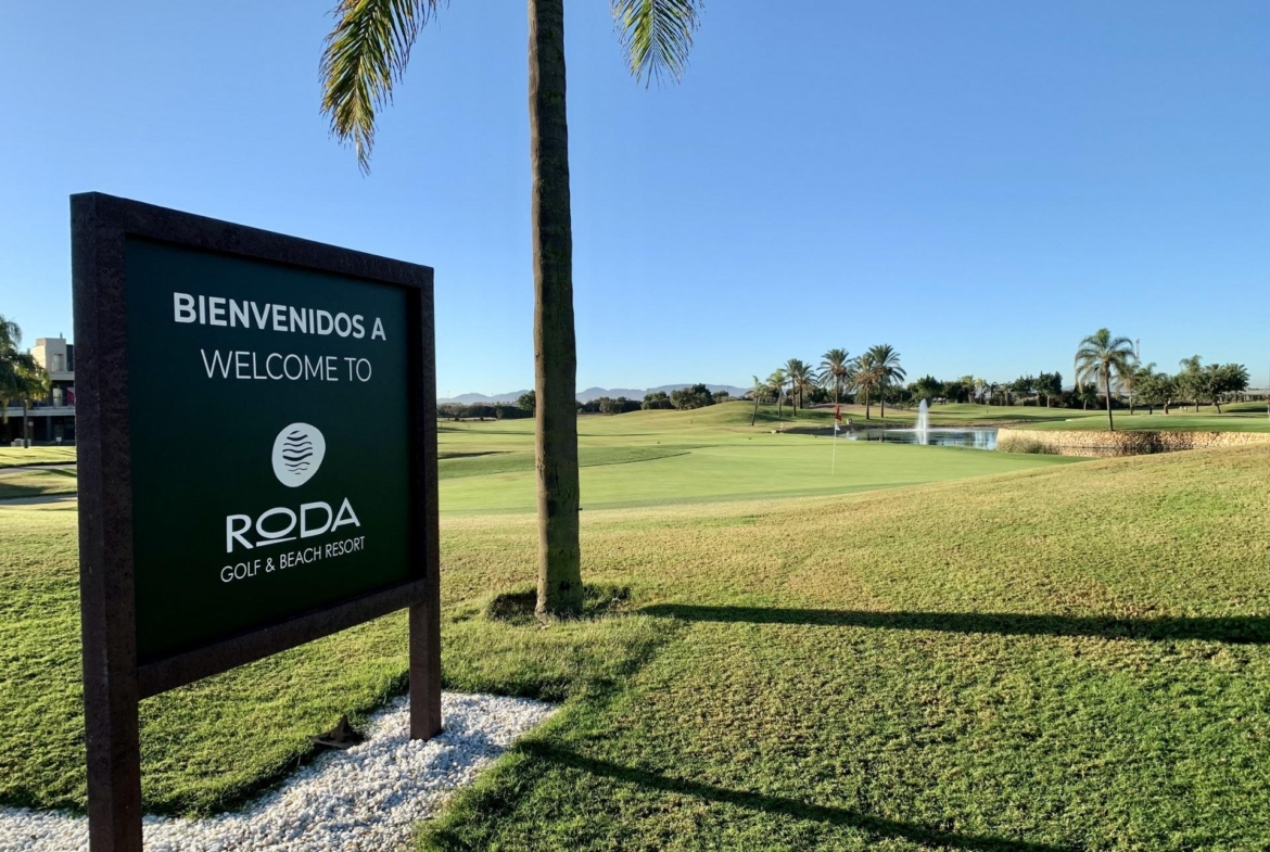 Sunlit, lush green golf course at Roda Golf & Beach Resort, serene setting near modern 3-bedroom penthouse in San Javier