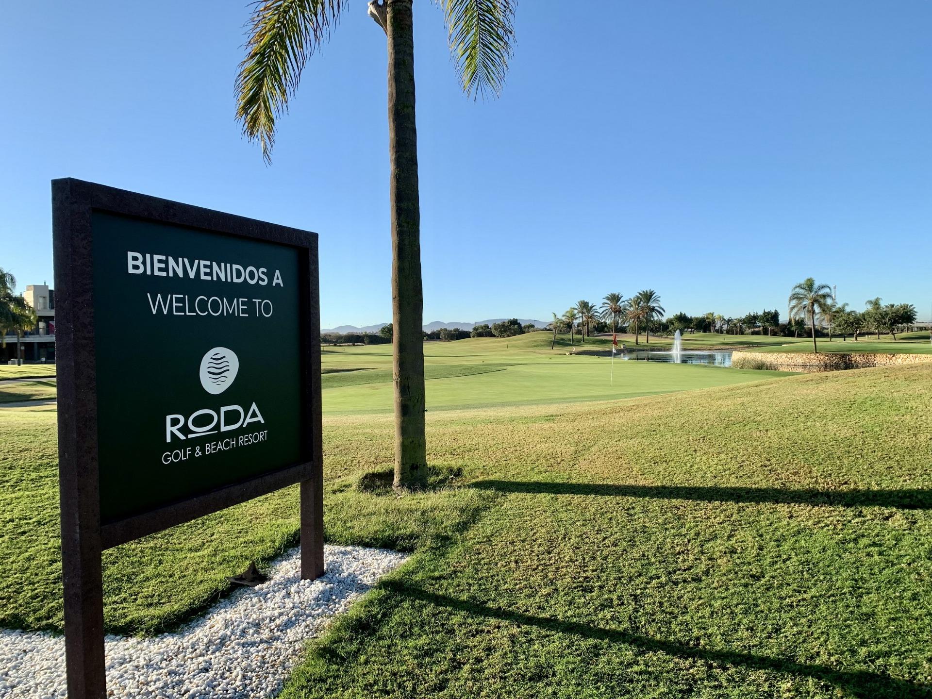 Sunlit, lush green golf course at Roda Golf & Beach Resort, serene setting near modern 3-bedroom penthouse in San Javier