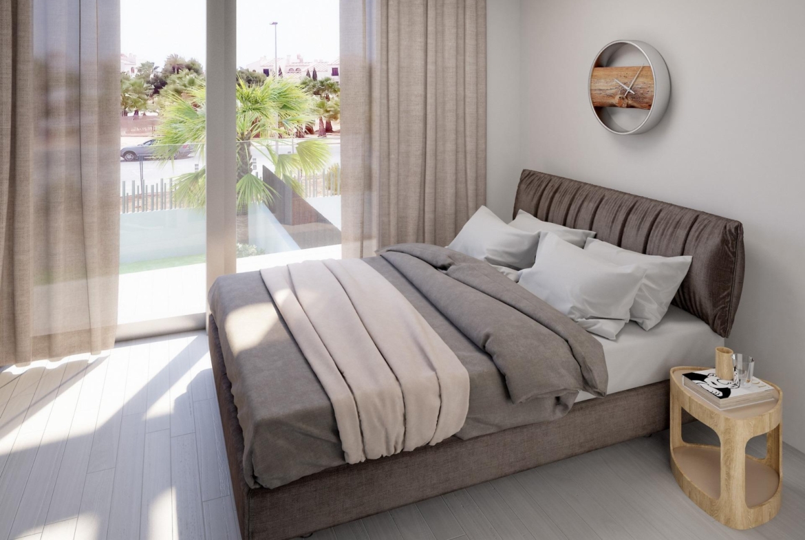 Bright, modern 3-bedroom villa bedroom with plush bed, soft linens, floor-to-ceiling windows, and pool view in Villamartin, Orihuela Costa.