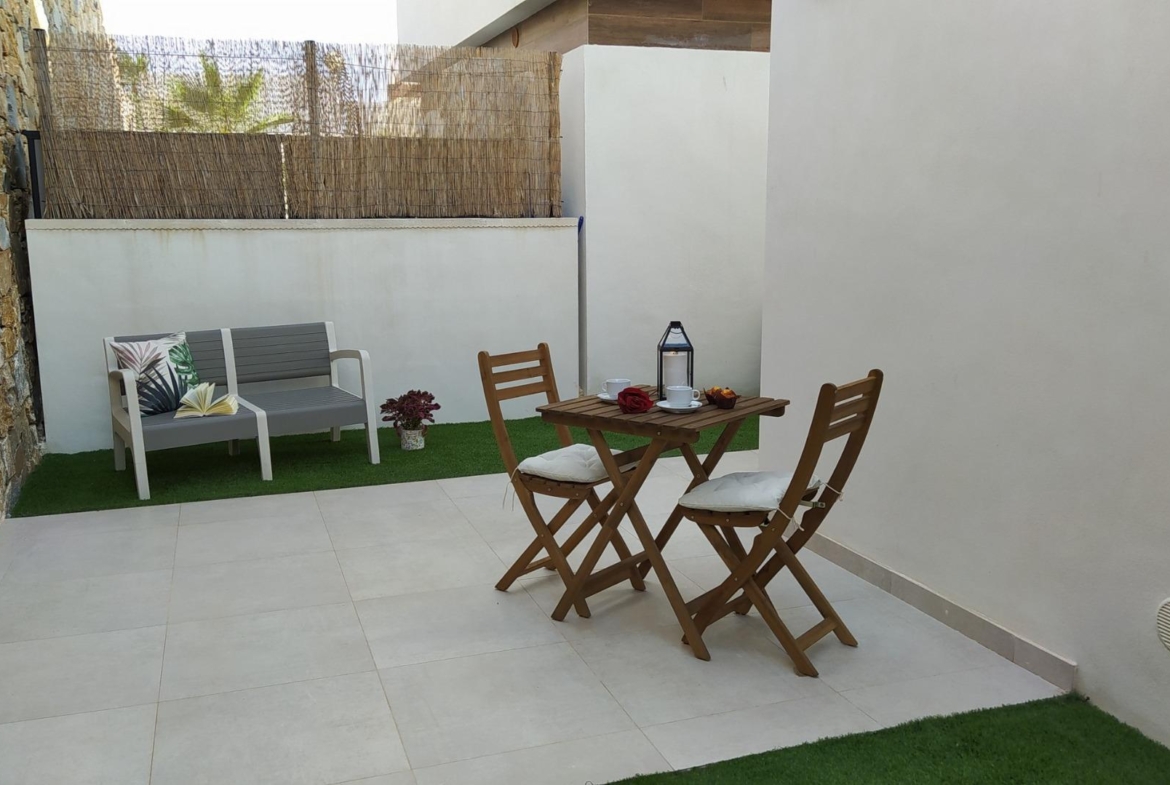 Bright and peaceful modern courtyard with outdoor seating in a 3-bedroom villa in Villamartin, Orihuela Costa.