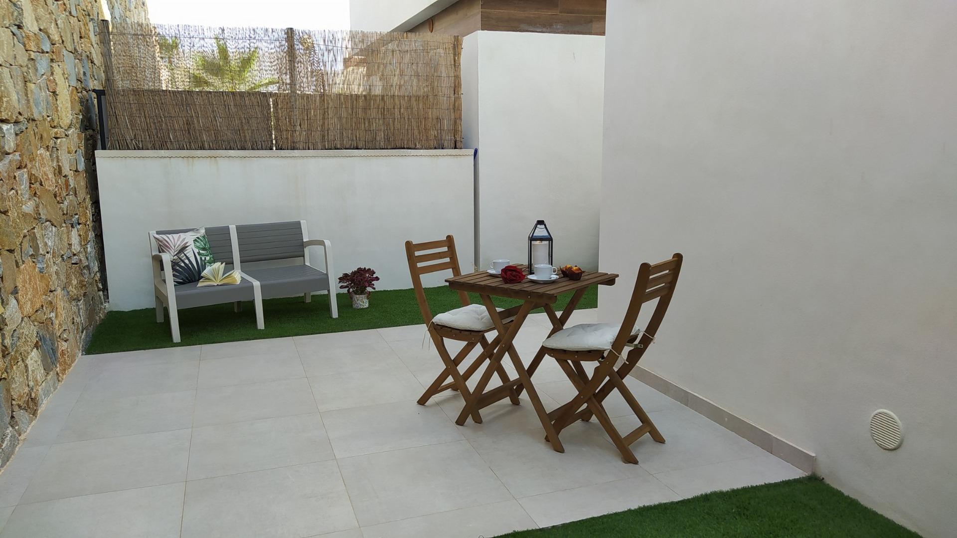 Bright and peaceful modern courtyard with outdoor seating in a 3-bedroom villa in Villamartin, Orihuela Costa.