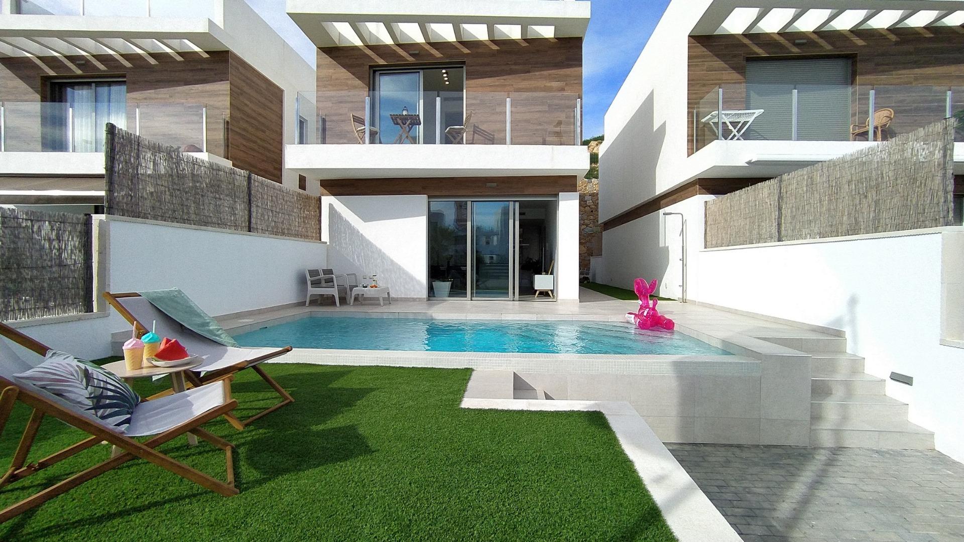 Modern 3-bedroom villa in Villamartin with private sun-drenched pool, sleek terrace, and stylish contemporary exterior.