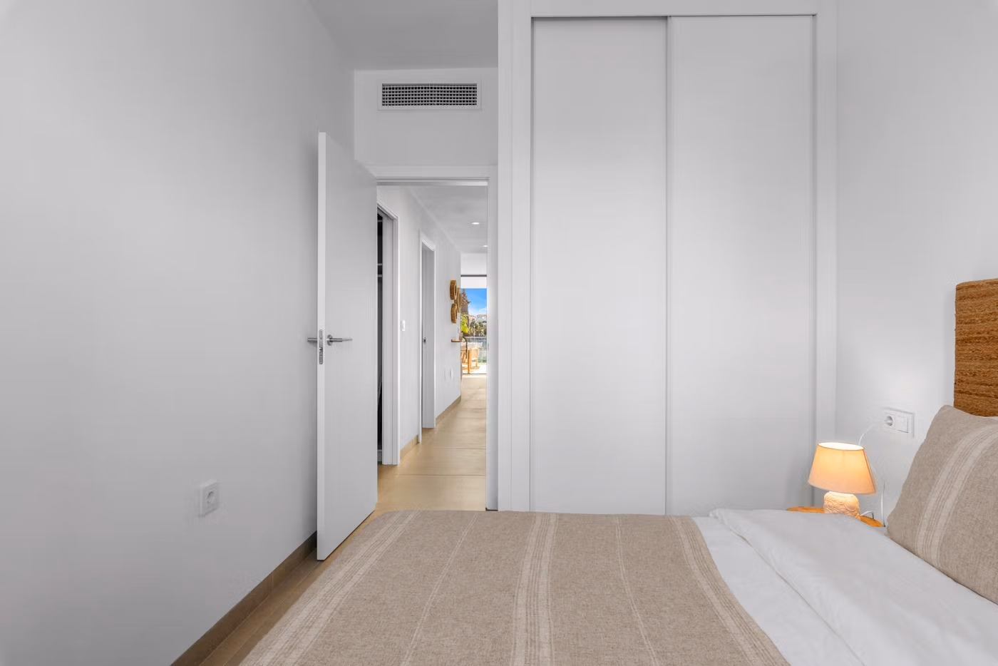 Bright, modern bedroom with neutral tones in elevated 2-bedroom penthouse featuring sleek design in Mar de Cristal.