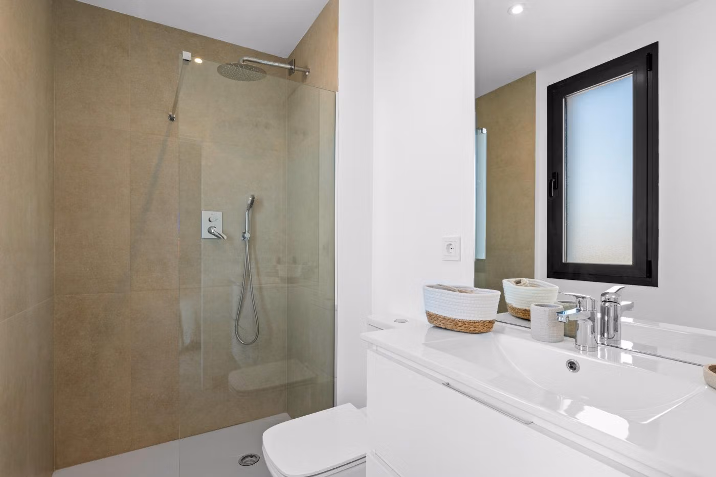 Modern, bright bathroom with walk-in shower and sleek fixtures in elevated 2-bedroom penthouse in Mar de Cristal