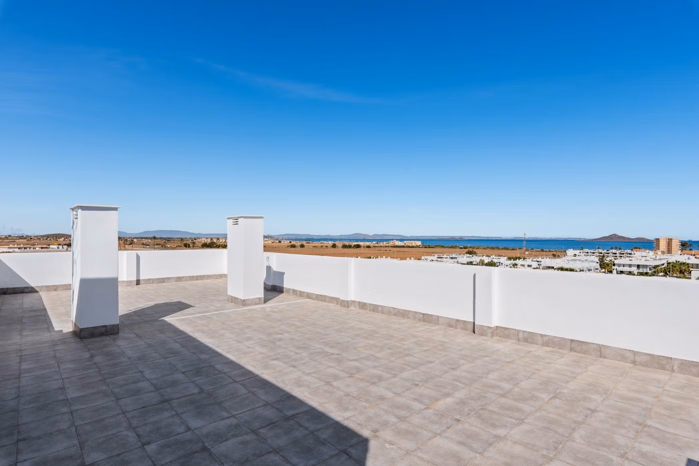 Spacious sun-drenched private solarium terrace with panoramic sea and landscape views in Mar de Cristal penthouse new build