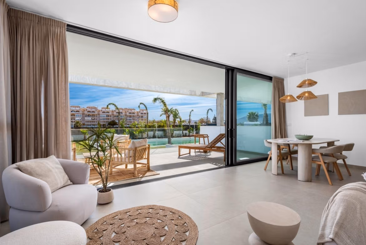 Bright open-plan living and dining area with sliding glass doors leading to a spacious terrace in a 2-bedroom penthouse, Mar de Cristal.
