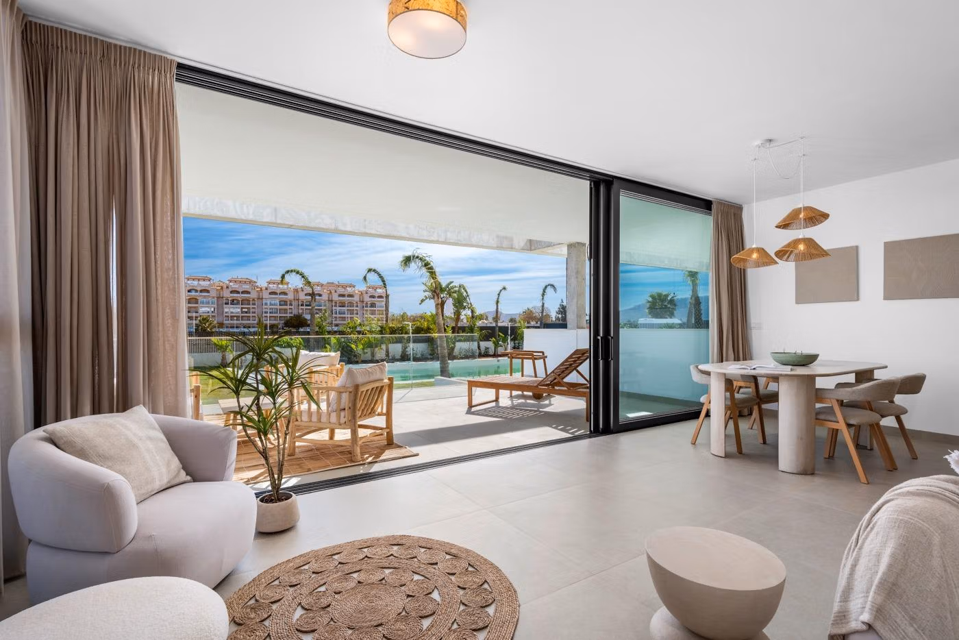 Bright open-plan living and dining area with sliding glass doors leading to a spacious terrace in a 2-bedroom penthouse, Mar de Cristal.