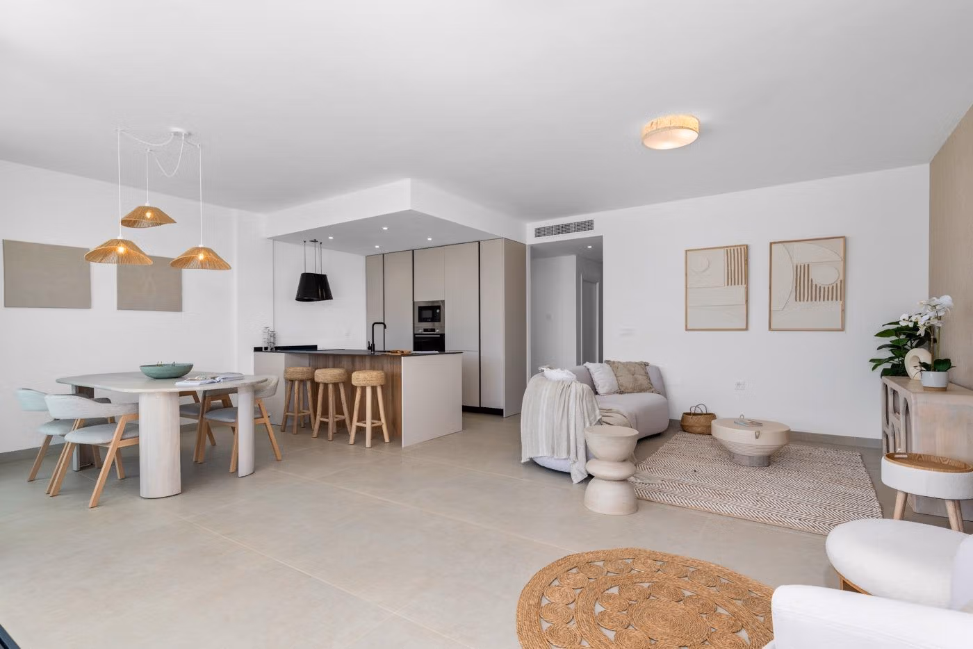Bright open-plan living and dining area with modern kitchen in elevated 2-bedroom penthouse with private solarium in Mar de Cristal.