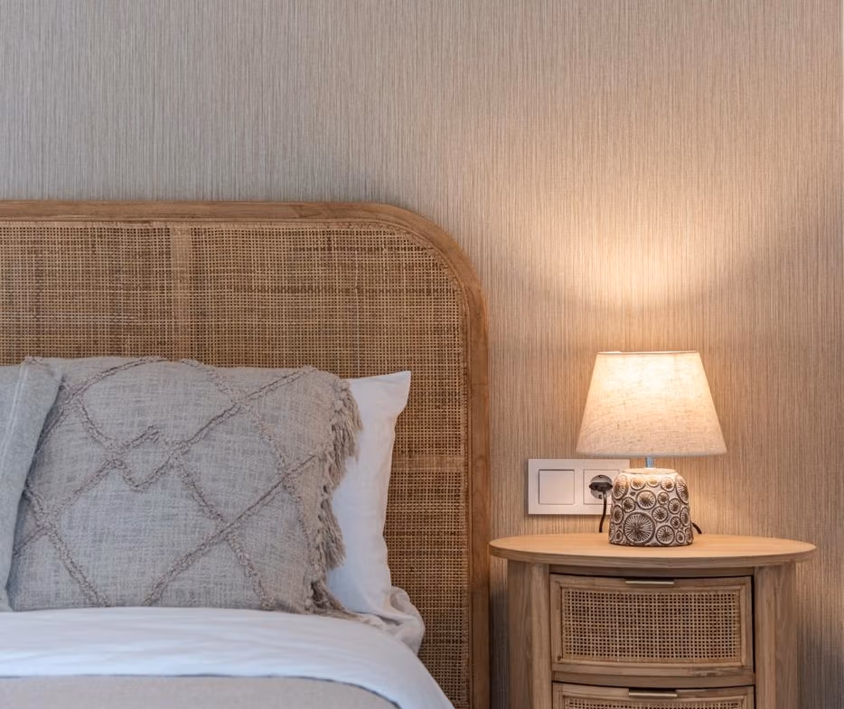 Cozy, elegantly styled bedroom in elevated 2-bedroom penthouse with natural textures in Mar de Cristal new build.