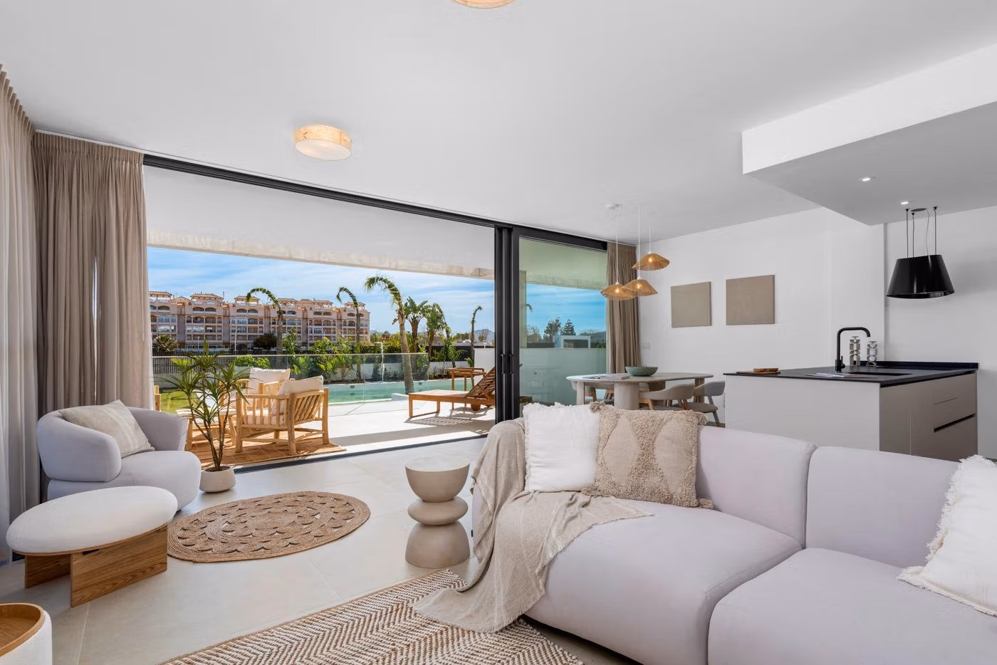 Bright and modern 2 bedroom penthouse living room with open-plan kitchen and spacious terrace overlooking Mar de Cristal.