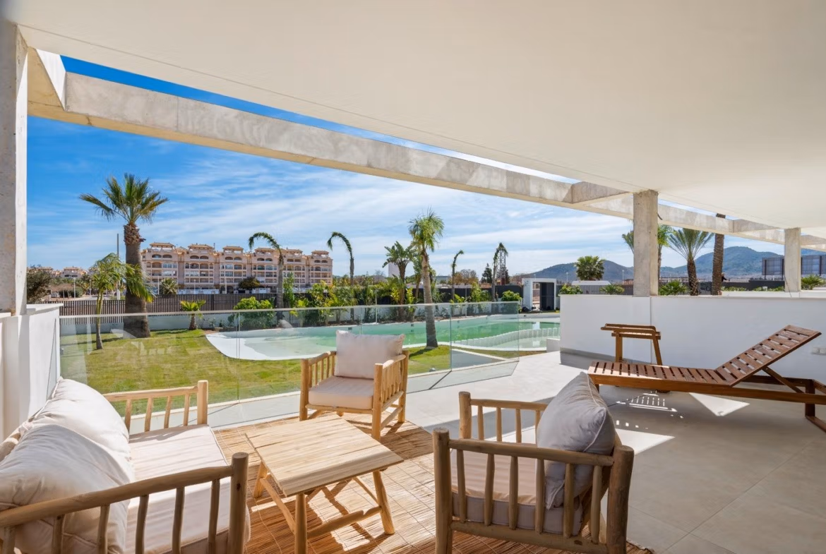 Spacious, sun-drenched terrace with modern seating and landscaped views in elevated 2-bedroom penthouse with private solarium, Mar de Cristal.