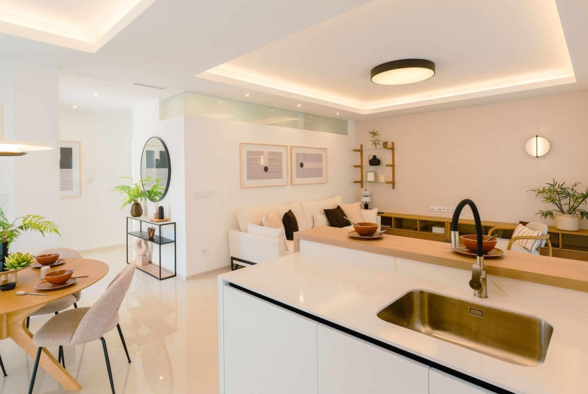 Bright modern open-plan kitchen and living area in a luxury 2-bedroom ground floor bungalow in Doña Pepa, Rojales.