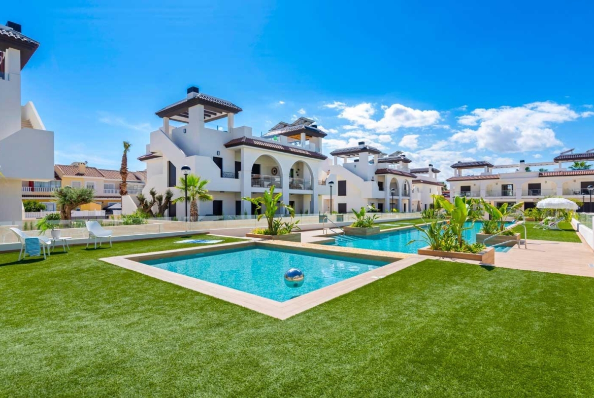 Sun-drenched modern two-bedroom ground floor bungalow with pristine pool and landscaped garden in Doña Pepa, Rojales.
