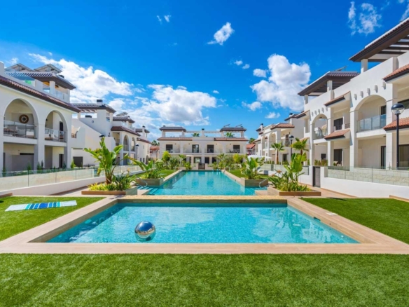 Sun-drenched modern ground floor bungalow complex with landscaped gardens and pristine pool in Doña Pepa, Rojales.