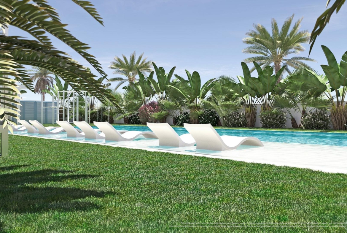 NEW-BUILD-RESIDENTIAL-COMPLEX-IN-TORRE-DE-LA-HORADADA-12 Sun-drenched pool area with modern loungers and lush tropical landscaping in luxury 3-bedroom top floor apartment in Torre de la Horadada