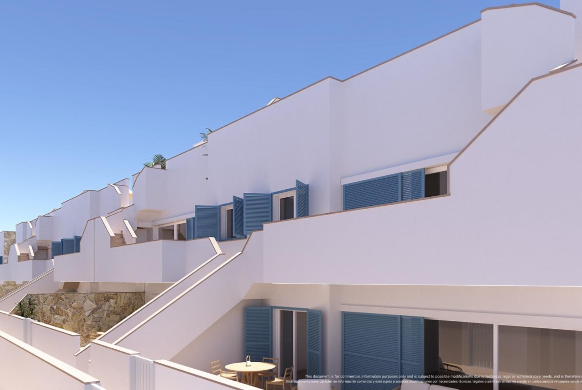 NEW-BUILD-RESIDENTIAL-COMPLEX-IN-TORRE-DE-LA-HORADADA-4 Bright modern top floor apartment exterior in Torre de la Horadada with spacious terraces, blue shutters, and sun-drenched solarium views.